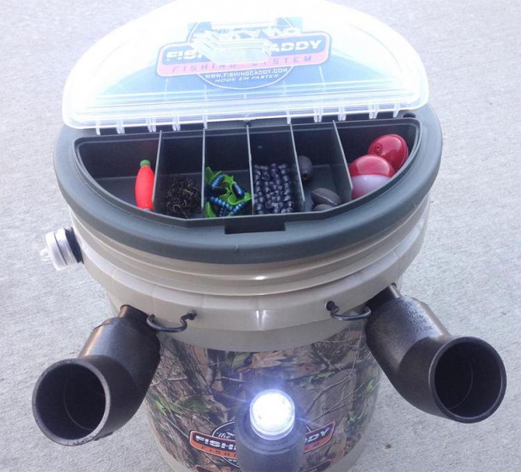 the fishing caddy combines a tackle-box, chair, and pole holder