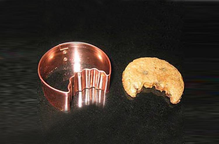 Once bitten cookie cutter - Cookie cutter makes cookies with a bite already taken out of cookie